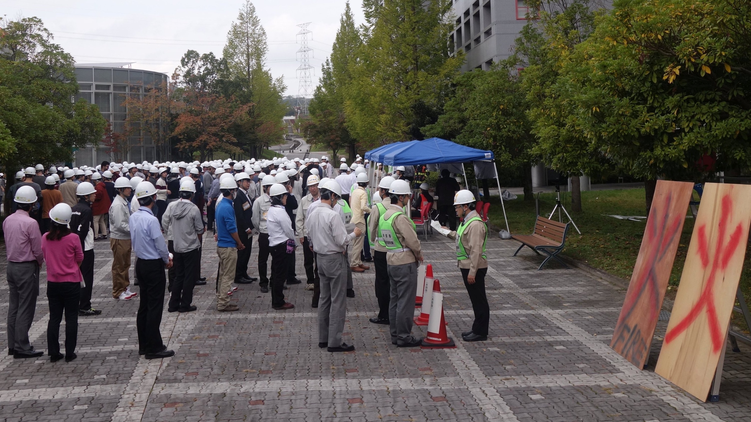 The evacuated students, staff and faculty gather to be counted and participate in the exercise.